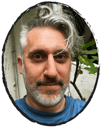 A 50 year old man smiling on the streets of Redfern.